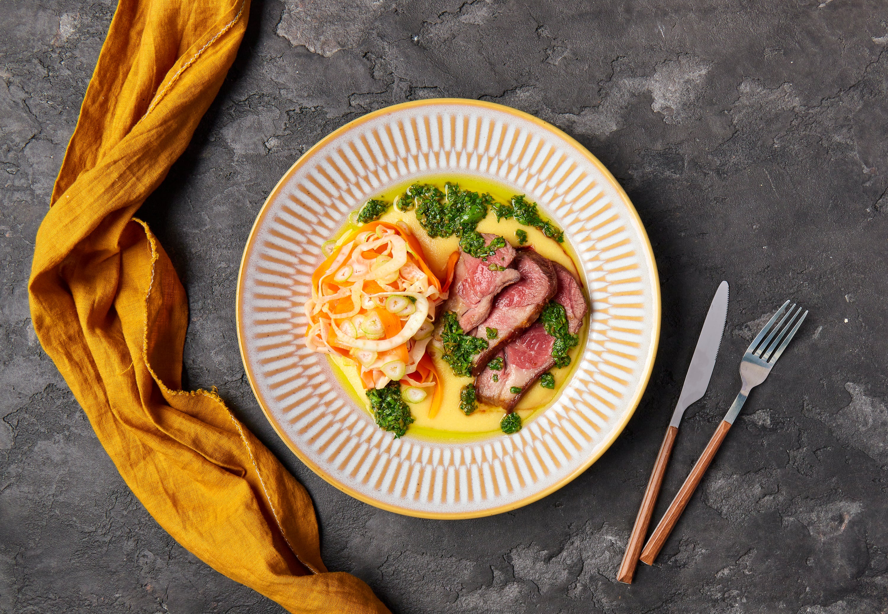 Pan Seared Lamb Leg with creamy polenta, salsa Verde & Carrot & Fennel Salad